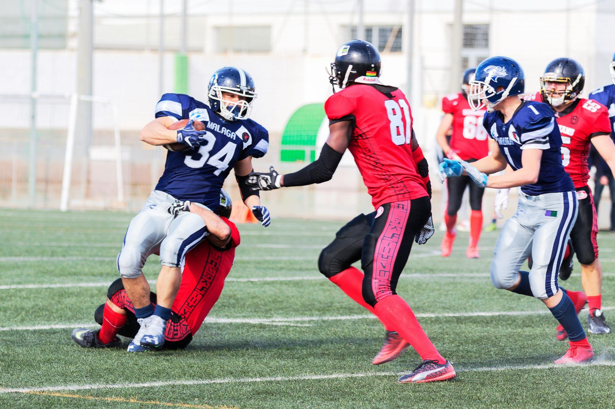 Football players from opposing teams during a play